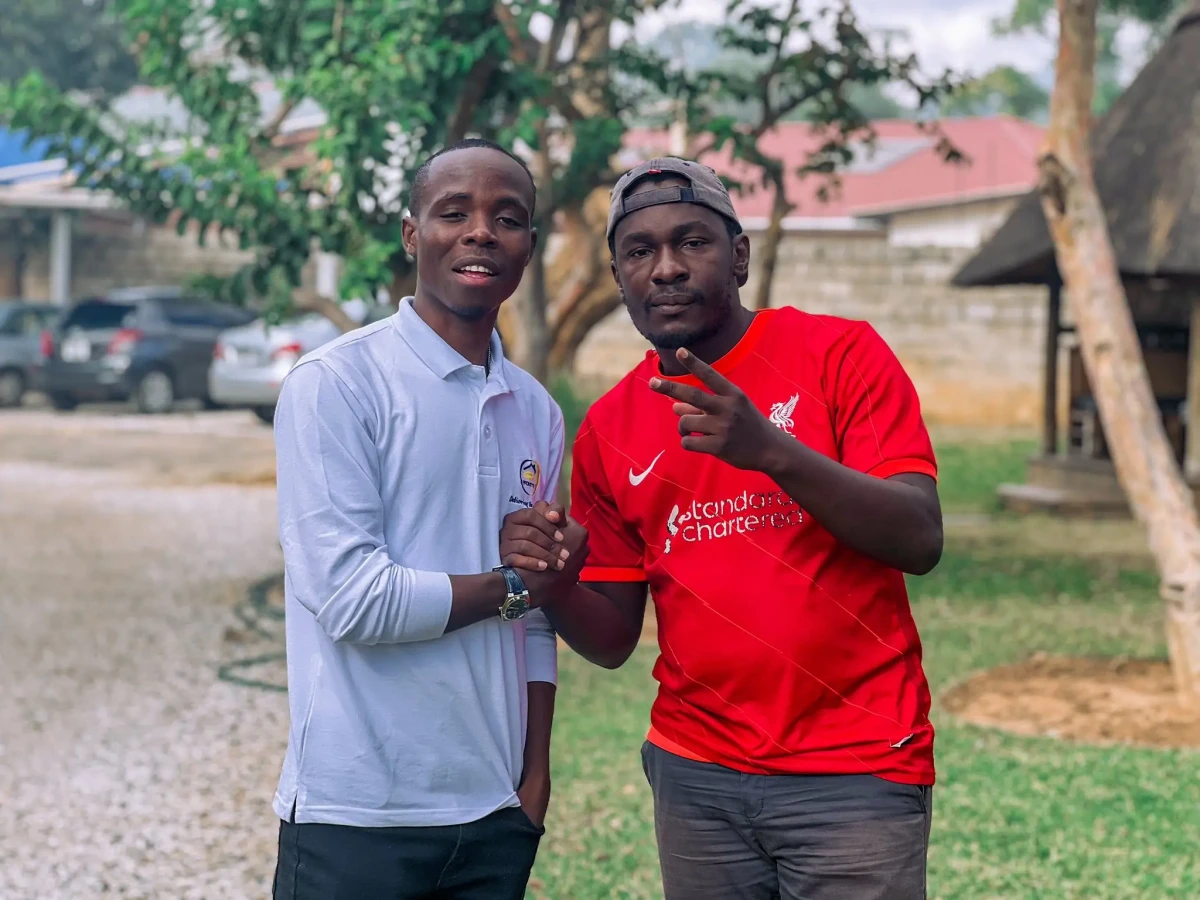 Muzo AKA Alphonso with Philanthropist Remmy Kangwa